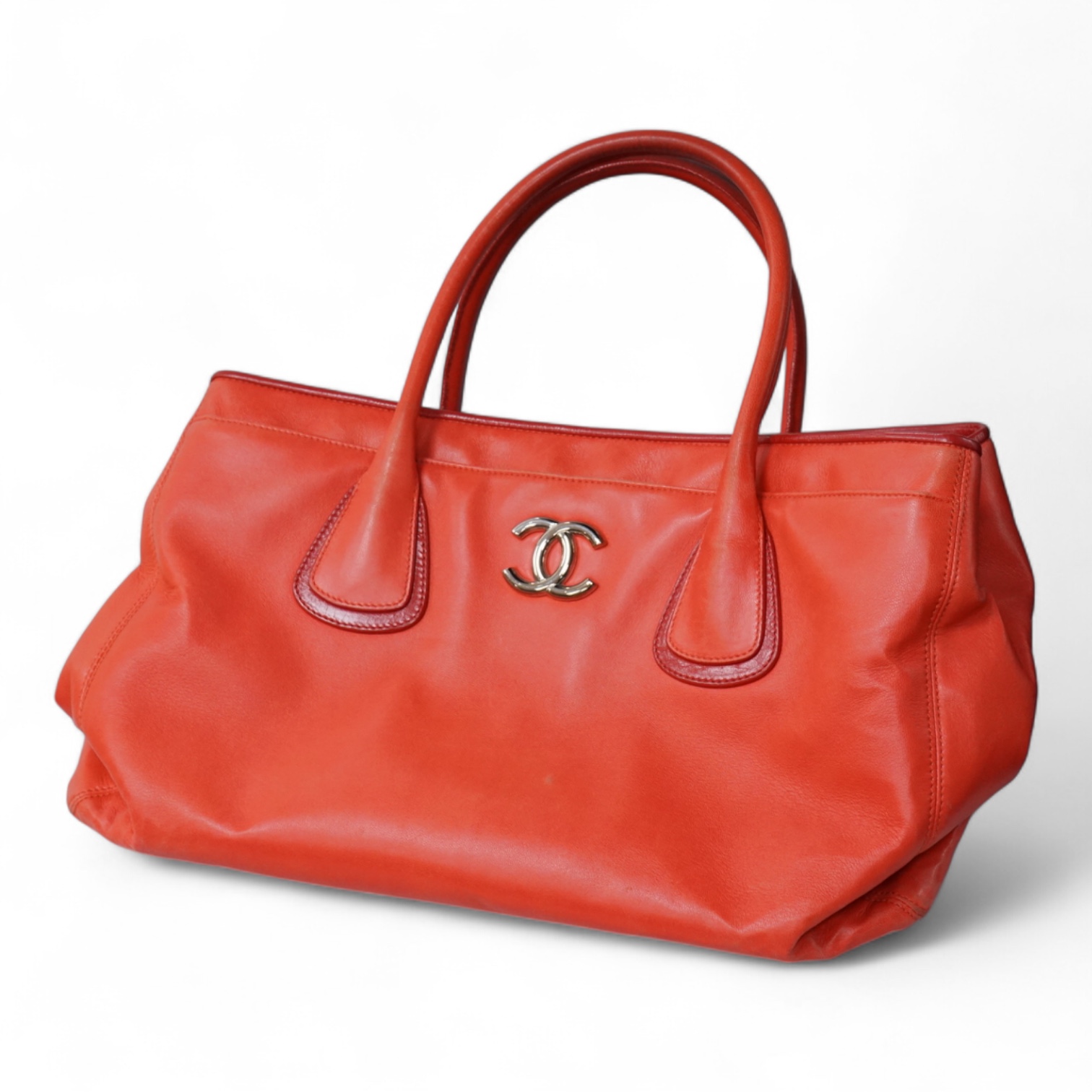 A Chanel red leather Executive Cerf tote bag with silver hardware, with original receipt and dust cover, 41cm wide, Provenance: Purchased by the vendor in Dubai, Chanel